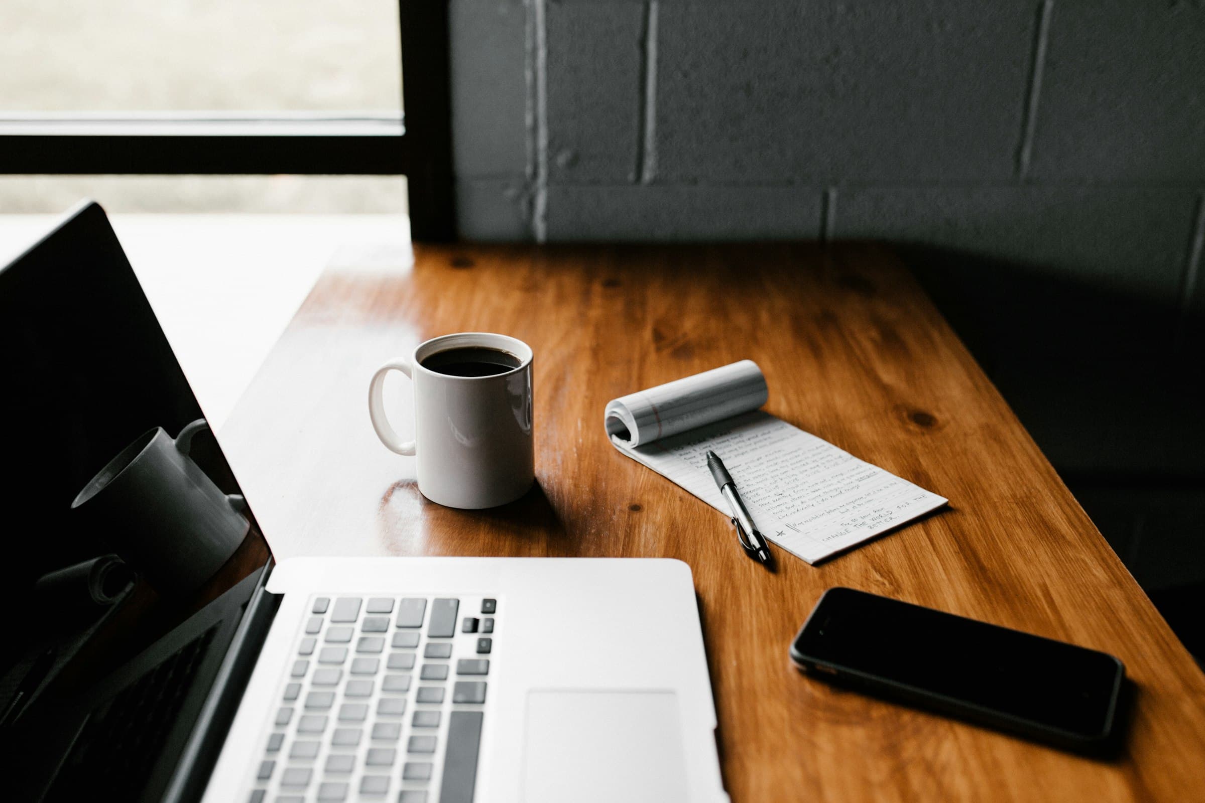 Person editing website content on a laptop, representing a content management system