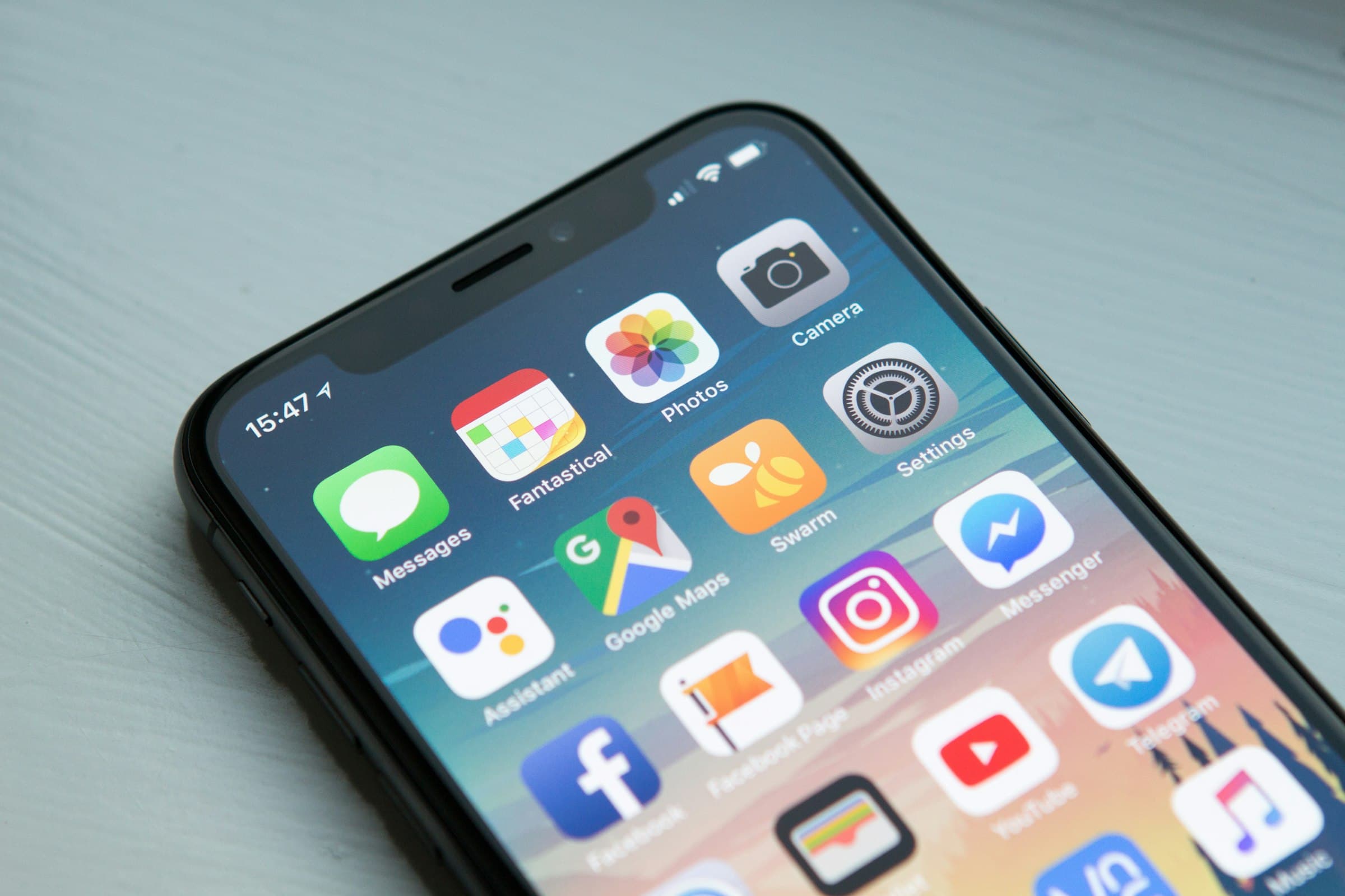 Person holding a smartphone showing a mobile application